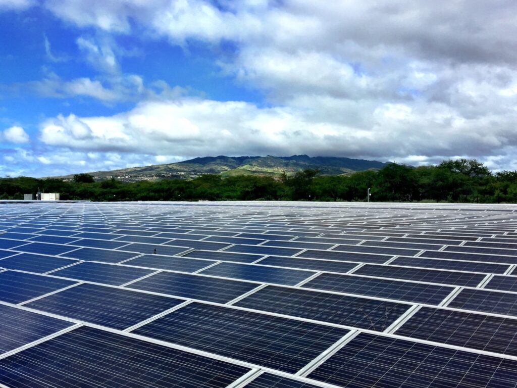 Large field of photovoltaic arrays at a Hawaii solar power station.