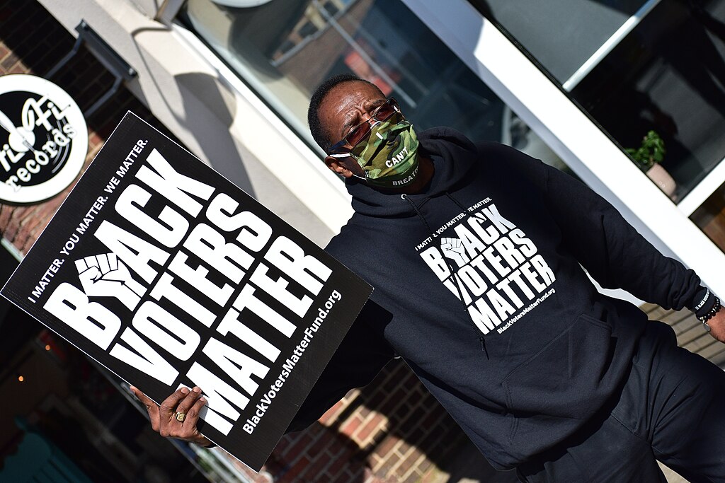 A man wearing a "Black Voters Matter" sweatshirt   on November 3, 2020. New analysis shows what's really happening in the polarization of voting in America.