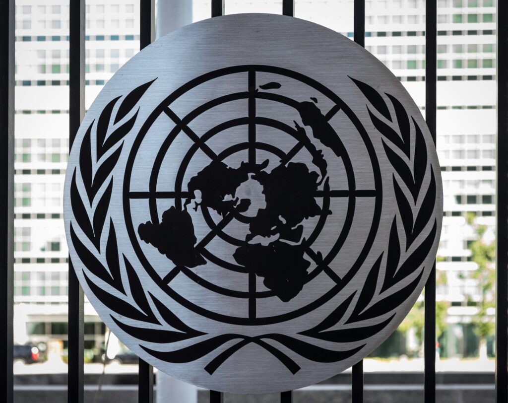 On U.N. Day, what's ahead for the multilateral institution, now 80 years old? Image shows the United Nations seal in a window at U.N. headquarters in New York. 